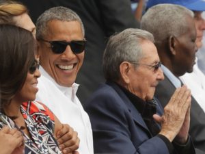 U.S. President Barack Obama and Cuban President Raul Castro arrive for an exposition game between the Cuban national team and the Major League Baseball team Tampa Bay Devil Rays at the Estado Latinoamericano March 22, 2016 in Havana, Cuba. This is the first time a sittng president has visited Cuba in 88 years.